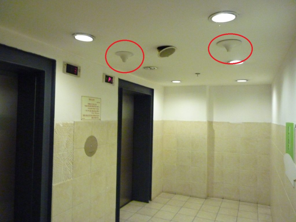 Micro-cell antennas in an elevator lobby room