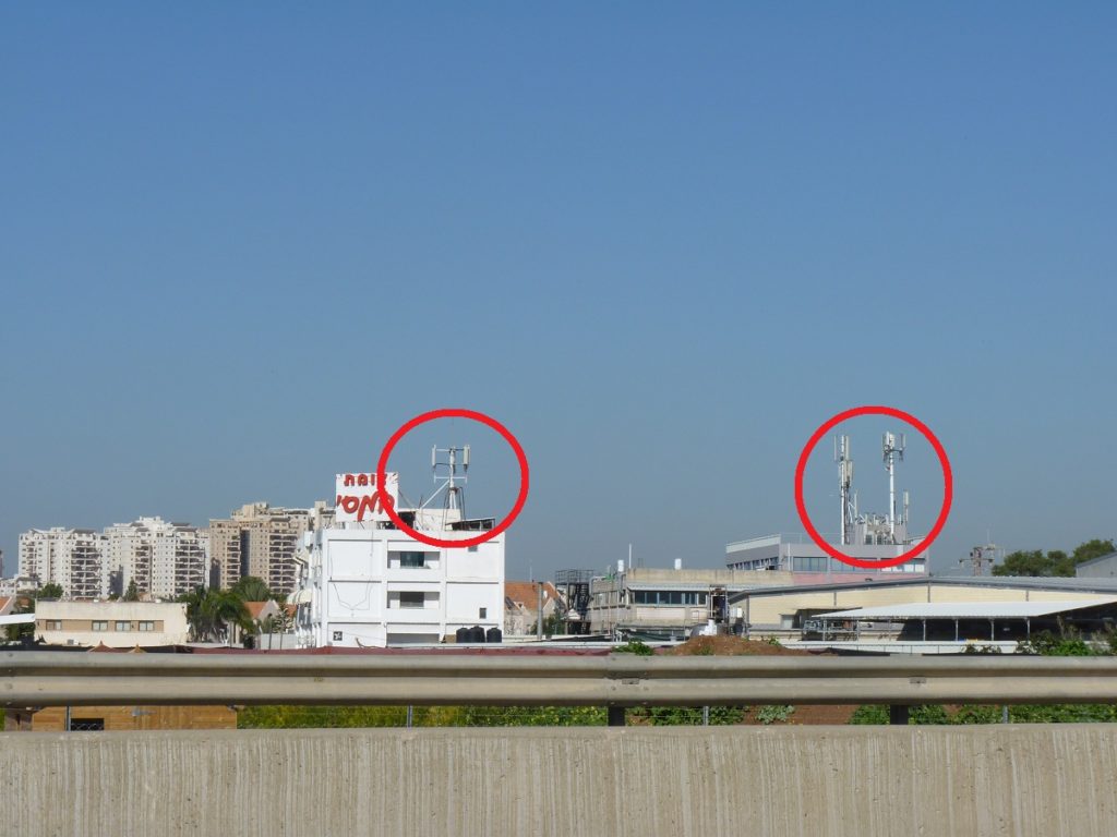 Antenna on buildings aside the road