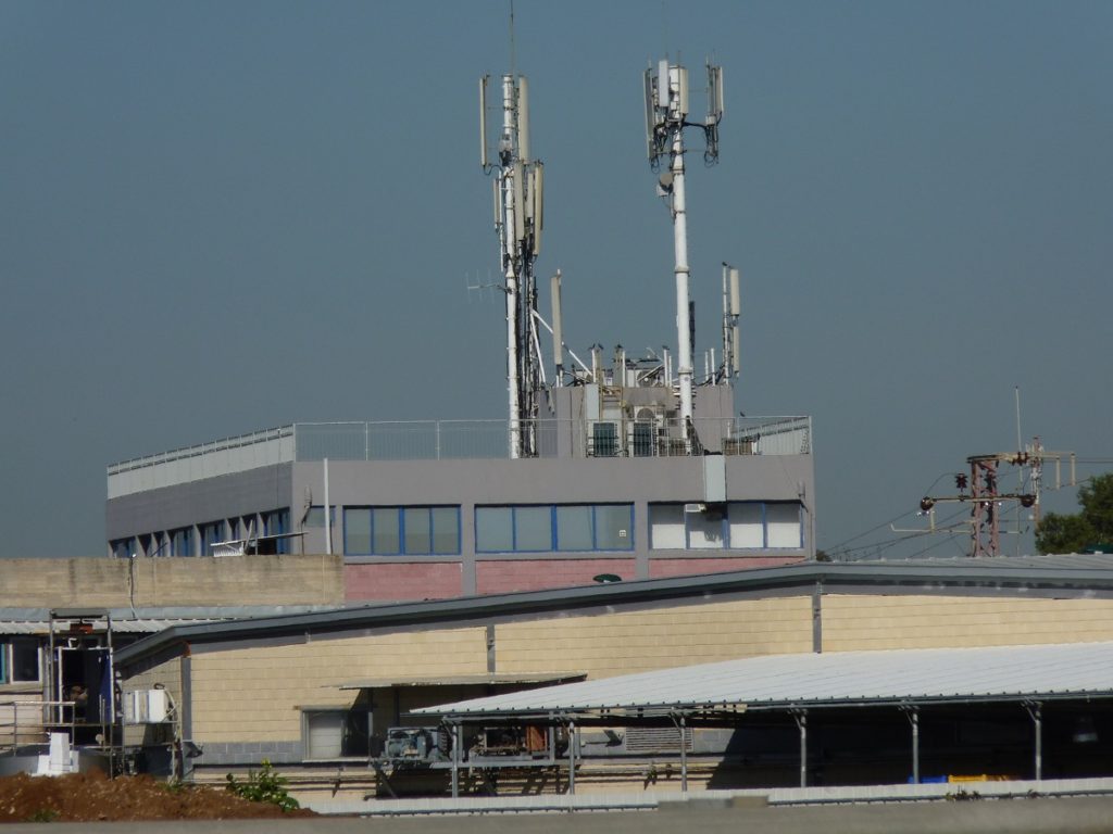 Antenna on buildings aside the road