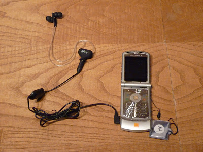 a Wired airtube earpiece connected to a GSM mobile phone